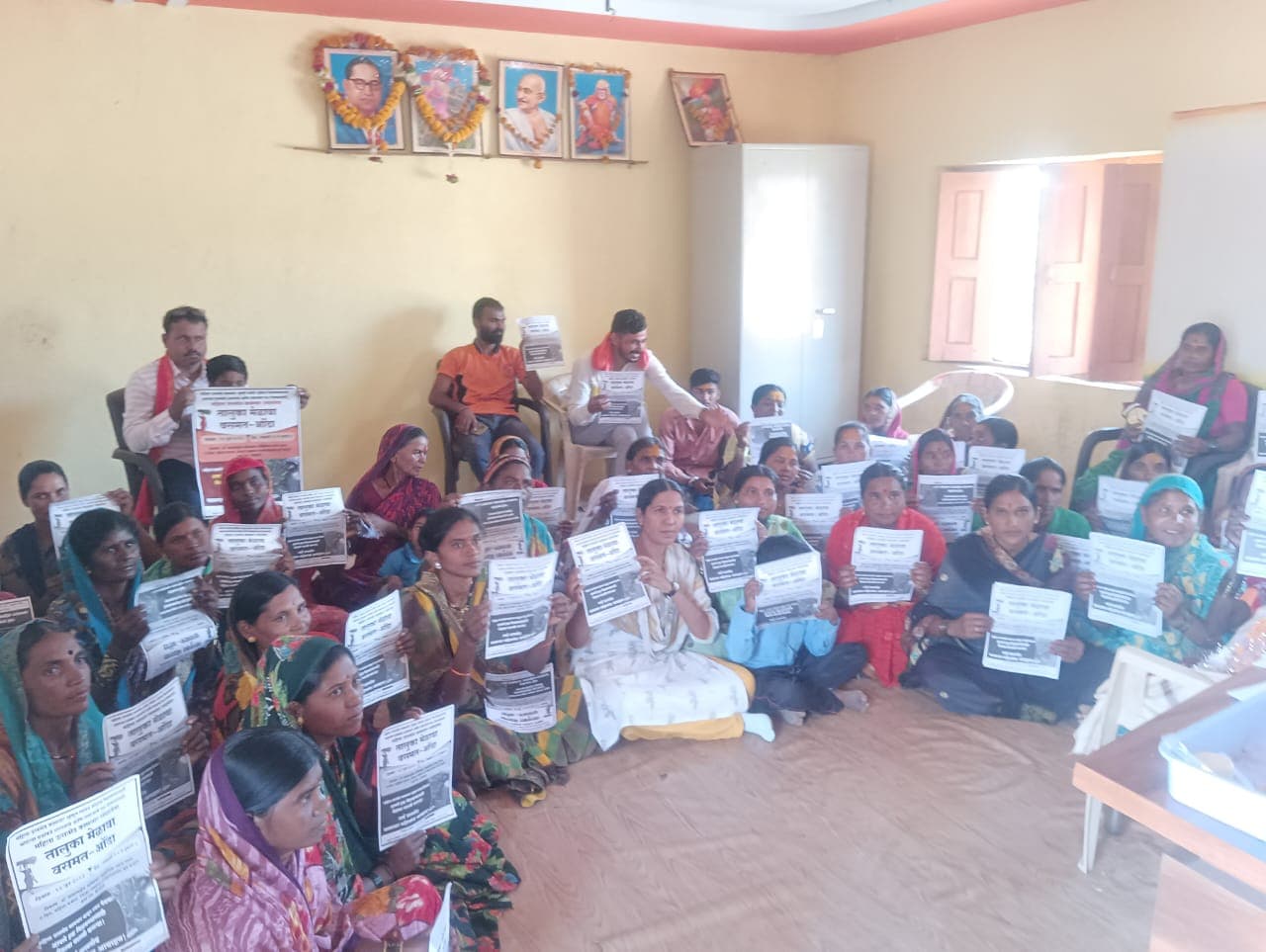 Women holding certificates after completing a training programme
