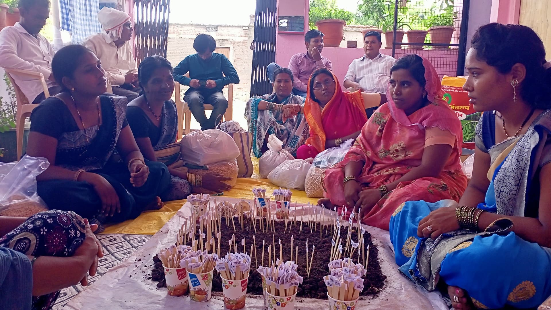 A women's gathering on a terrace during a community programme